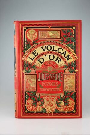 Jules Verne : Le volcan d'or. Paris, Hetzel, sd (1906). Un volume grand in-8° relié pleine percaline d'éditeur à décor, cartonnage à l'éléphant avec le titre dans l'éventail, dos au phare. Très bel intérieur très frais, le cartonnage également. Magnifique exemplaire de premier tirage! Magnifique exemplaire de la collection Hetzel, dos au phare! Un Jules Verne magnifique, et de premier tirage!