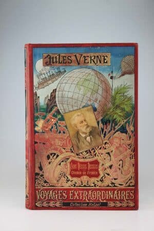 Sans dessus dessous & Le chemin de France. Paris, Hetzel, Sd (1892, mais catalogue EX, ce qui est normal) Un volume grand in-8 relié pleine percaline d'éditeur, cartonnage au portrait collé. Nombreuses marques du temps, quelques rousseurs. Ensemble un peu terne, le dos surtout. Bon exemplaire de ce titre si rare au phare, et encore davantage sous cet avatar éphémère. Tel quel. Dos au phare, collection Hetzel!